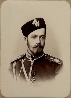 an old photo of a man in a military uniform with a beard