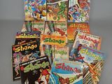 a lot of comic books that are on the table