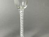 a wine glass that is sitting on a table
