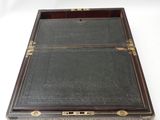 a black leather and brass - plated box with two compartments