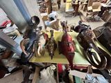 many different types of shoes on a table in a room