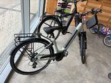 two bikes parked next to each other in a room