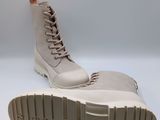 lace - up boots with rubber soles on a white background