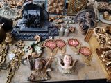 a table with a lot of antique items on it