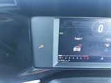 the dashboard of a car with a digital display on it