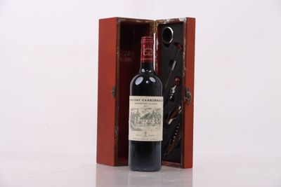a bottle of wine in a wooden box on a table