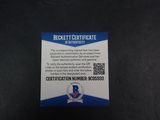 a close up of a blue and white certificate on a black surface