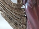 statue of a woman with wings on a white background