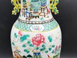 a vase that has a lid on it on a table