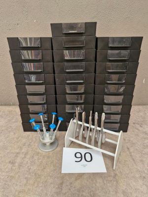 a stack of black drawers with a number on it