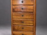 a wooden chest of drawers with five drawers on one side and three drawers on the other