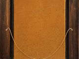 an old picture frame with a rope hanging from it ' s side