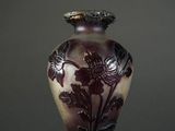 an image of a vase with a flower design on it