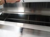 a person that is standing in front of a conveyor belt