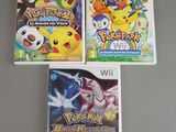 three nintendo wii games are sitting on top of a table