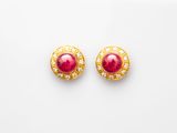 a pair of ruby and diamond earrings