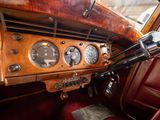 a dashboard of an old car with many gauges on it