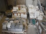 a lot of boxes and boxes of marble on a pallet