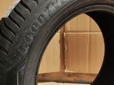 tires are stacked on a cardboard box in front of a cardboard box