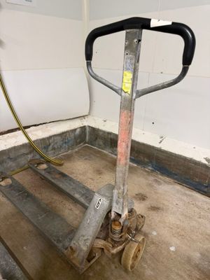 a hand truck that is sitting in the middle of a room