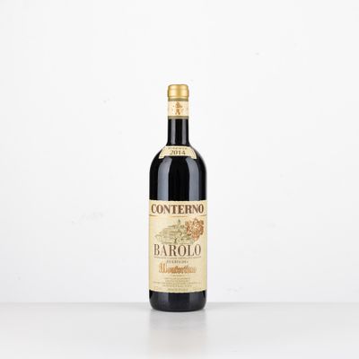 a bottle of red wine sitting on top of a table