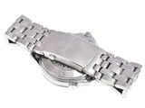 a watch that is laying on a white surface