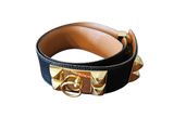 black and gold leather belt with metal buckle