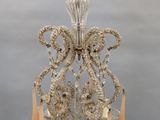 an image of a crystal chandelier hanging from a ceiling