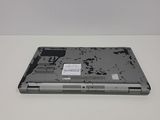 a laptop with a broken screen sitting on a table