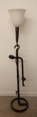 a lamp that is sitting on a stand in a room