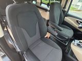two seats in the back of a van that is empty