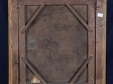 an old wooden easel with a painting on top of it
