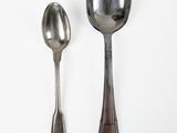 two spoons and a spoon on a white surface