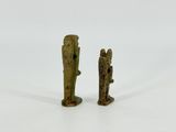 pair of ancient bronze figurines of a man and a woman