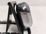 a close up view of a computer mouse on a stand