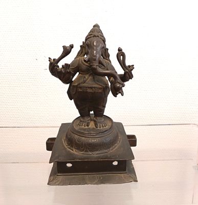 a bronze statue of an elephant on a pedestal