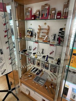 a glass display case with many different items in it