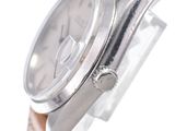 an image of a close up of a watch on a white surface
