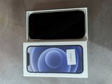 an iphone 12 is sitting in a box on a table