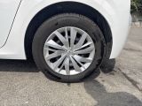 a white car that is parked in a parking lot