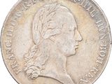 gros plan d'une pièce de monnaie sur laquelle figure une tête de femme