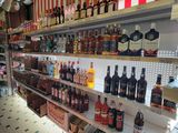 many bottles of alcohol on the shelves in the store