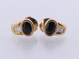 an image of a pair of black and white diamond earrings