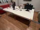 a large white table in the middle of a living room