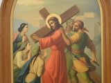 painting of jesus carrying the cross with other people