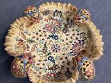 a small bowl with a decorative design on it