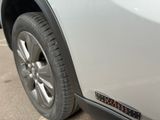 a close up of a car ' s tire with a sticker on it