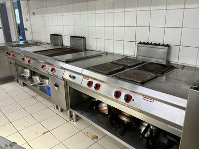 many stainless steel appliances in the kitchen of this restaurant
