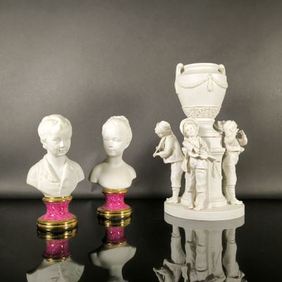 three figurines that are sitting on a table