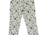Les leggings pour enfants sont ornés d'un imprimé de fleurs noires et blanches